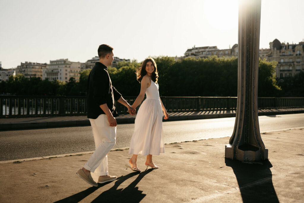 couple at golden hour on bir hakeim bridge
