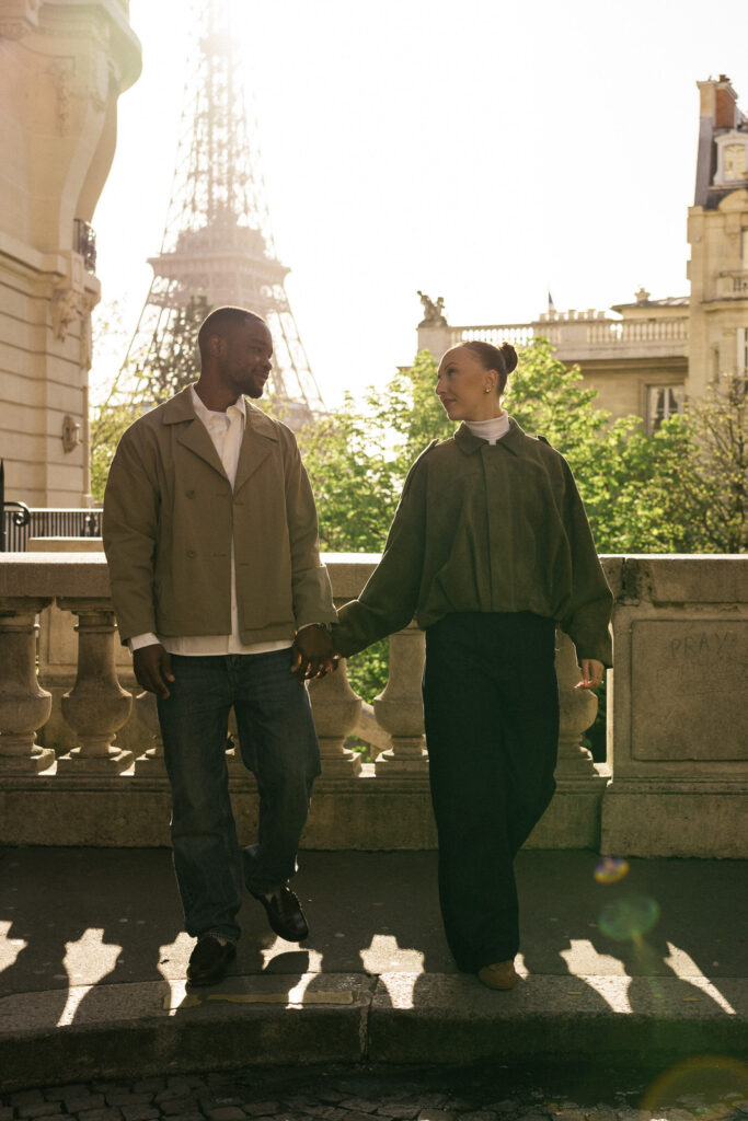 couple looking at each other eiffel tower background