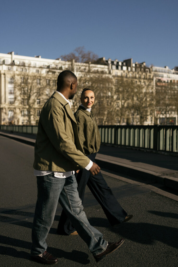 stylish couple crossing the street