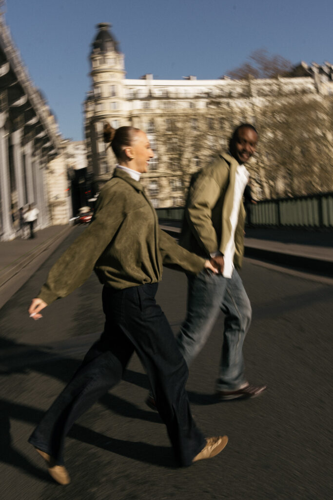 stylish couple crossing the street