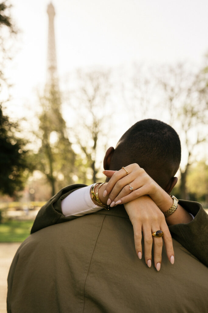 close up shot of engagement ring with eiffel tower background